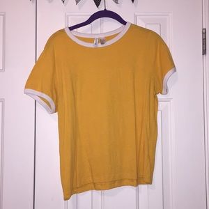 yellow shirt with white trim